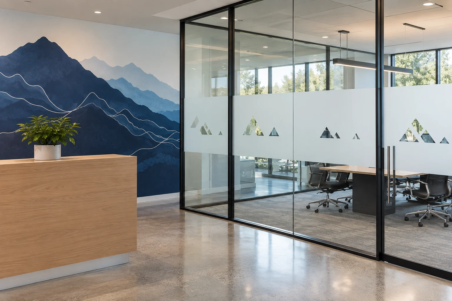 Concept office with decorative privacy film and a mountain wall graphic